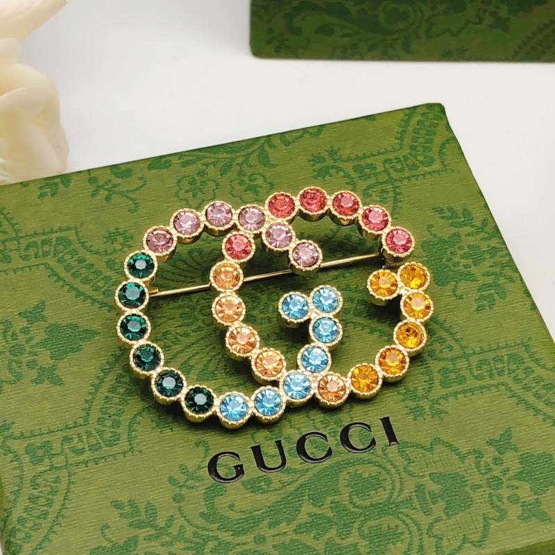 Gvc*1 brooches